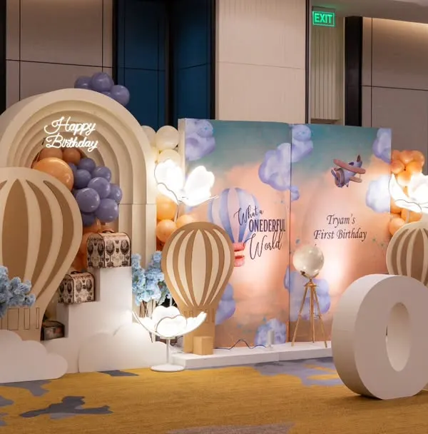 This is the kind of art I create for a first birthday. A "Wonderful World" theme brought to life with custom backdrops, hot air balloon props, and soft lighting to make the milestone truly magical. If you believe your event should be a work of art, we're on the same page.
