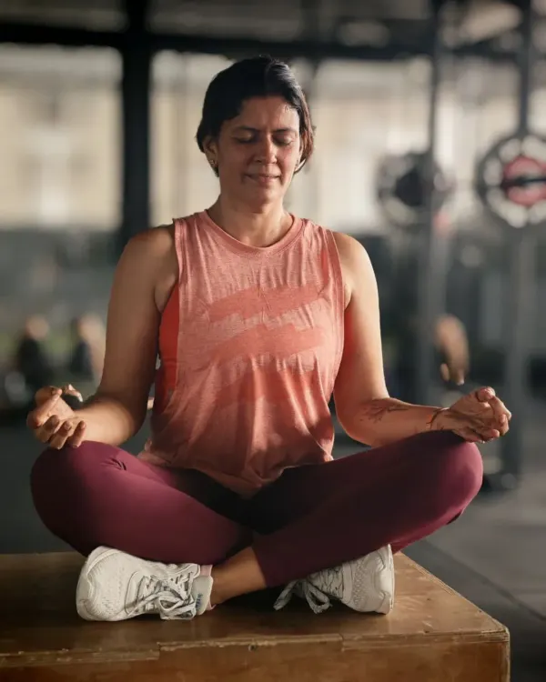 Padmasana in sneakers. This image captures the heart of my practice. Yoga gave me awareness, and lifting gave me power. Together, they have made me feel unstoppable, and I want to share that feeling with you.