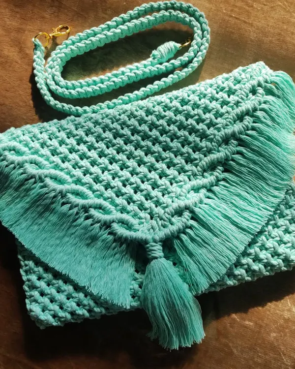 This mint green macrame sling bag is a perfect mix of craftsmanship and modern aesthetics. It's stylish, functional, and handmade with intricate detail.