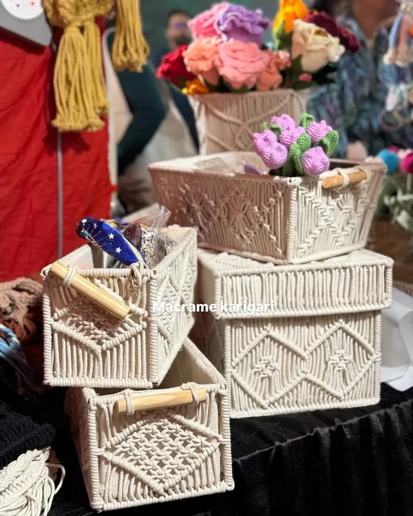 A collection of our macramé storage baskets in various shapes and sizes. Featuring wooden handles and intricate patterns, they are perfect for organizing everything from toiletries to craft supplies.
