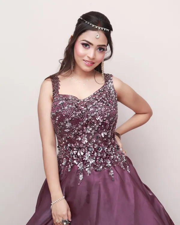A beautiful studio portrait of a woman in an elegant, sequined gown. This type of session is perfect for capturing a glamorous look for a portfolio or special event.