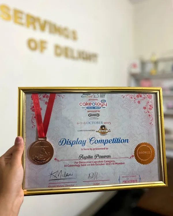 A proud moment for me. I was so excited to participate in Cakeology, India's largest cake show, and even won a medal in the cupcake display competition. This is more than a hobby; it's my passion.