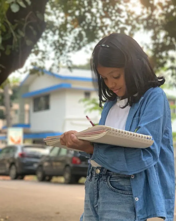 We believe art is not confined to four walls. Here, a young artist from our Junior Pencil and Chai program finds inspiration in the world around her during an outdoor sketching session, learning to observe and capture life as it happens.