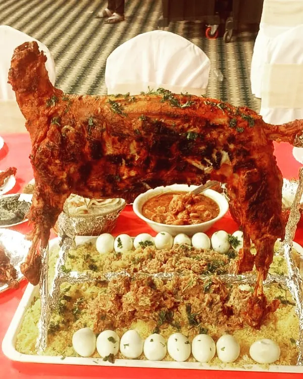 A true centerpiece for any grand celebration, our whole roasted lamb is slow-cooked to perfection and served on a bed of aromatic rice. It's a dish that guarantees a memorable dining experience for your most special events, like a groom's dinner or Valima.