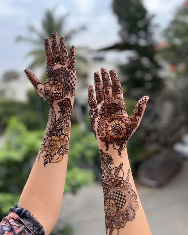 A beautiful floral henna design against a natural backdrop. This style is perfect for someone who loves botanical and flowing patterns.