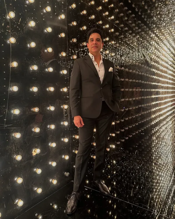 Dressed for the occasion and ready to set the mood. This is me in my element, surrounded by lights, ready for a night where the vibe will be just right.
