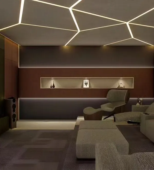 A modern home theater with geometric LED ceiling lights and comfortable recliner chairs. The design focuses on creating an immersive atmosphere with dark walls and ambient lighting.