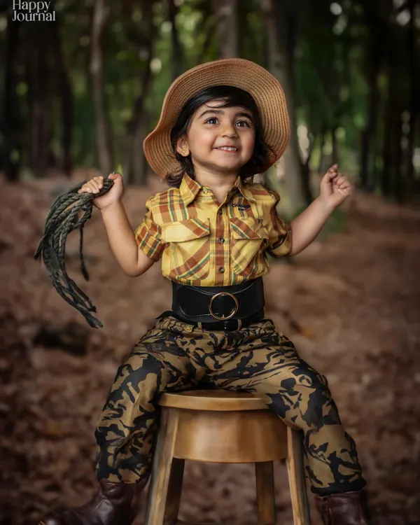 Our little cowgirl exploring the woods! The natural forest background is the perfect setting for an adventurous and imaginative themed shoot.