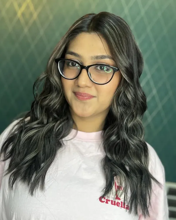 A mesmerizing journey from brassy copper to cool ash grey. This transformation required precision and expertise to neutralize warmth and achieve this stunning, multi-dimensional grey look.