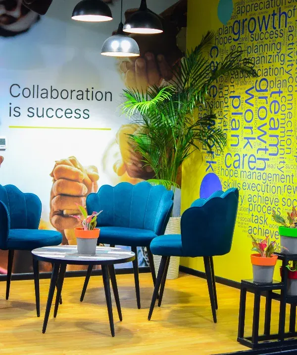 I created this green-filled breakout area to foster collaboration and creativity. The tiered planters add a splash of color and life, making it a more inviting and energetic space for employees to connect.