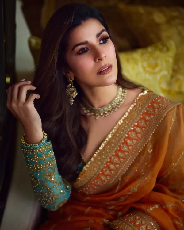 A beautiful portrait of Nimrat Kaur. For this celebrity makeup look, I focused on creating a warm, inviting gaze with soft brown tones and defined lashes, ensuring she looked captivating on camera.