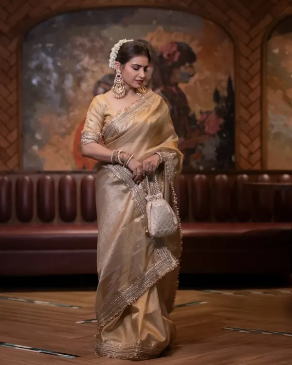 A tribute to the timeless beauty of Rekha ji. We recreated her iconic golden Kanjeevaram saree look, focusing on the classic makeup and a traditional floral bun.