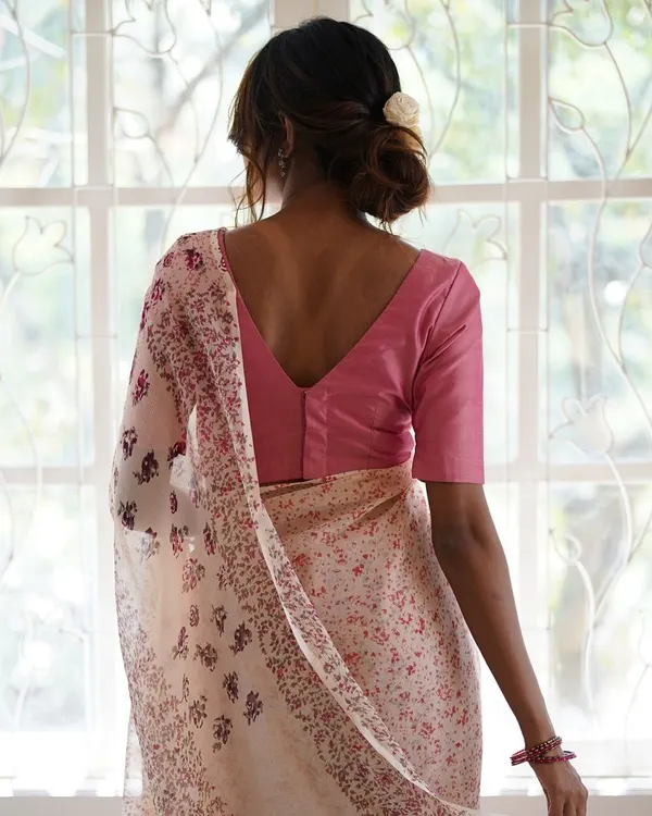 The Kāmini saree, crafted from dreamy silk chiffon, is a delicate floral beauty. It took 80 hours to create, using 20 different hand-carved vintage woodblocks to achieve its soft, flowing design.