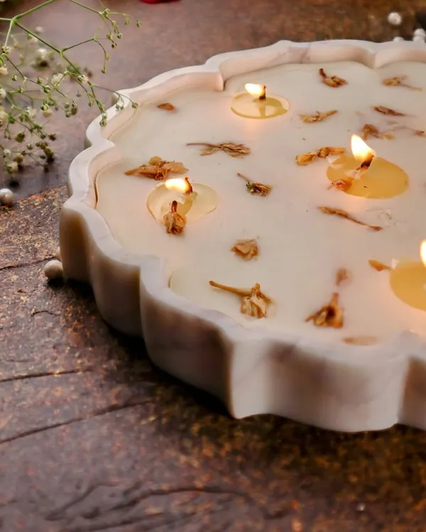 My Lotus Marble Urli Candle, a symbol of prosperity and grace, scented with divine mogra to fill your space with calm.