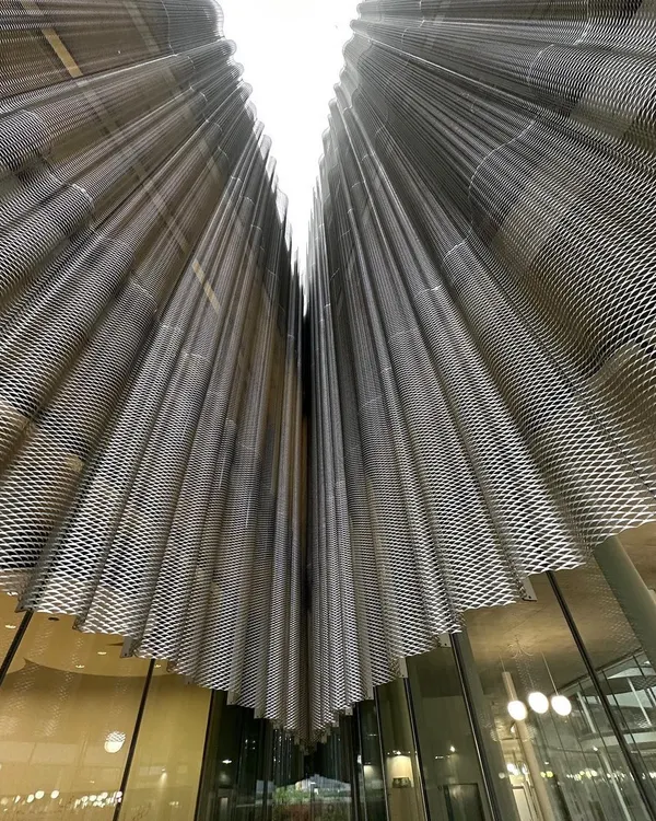 The expanded metal skin of the Bocconi University building in Milan by SANAA. I am fascinated by how architects use materials to create building skins that are both solid and transparent, like fabric.