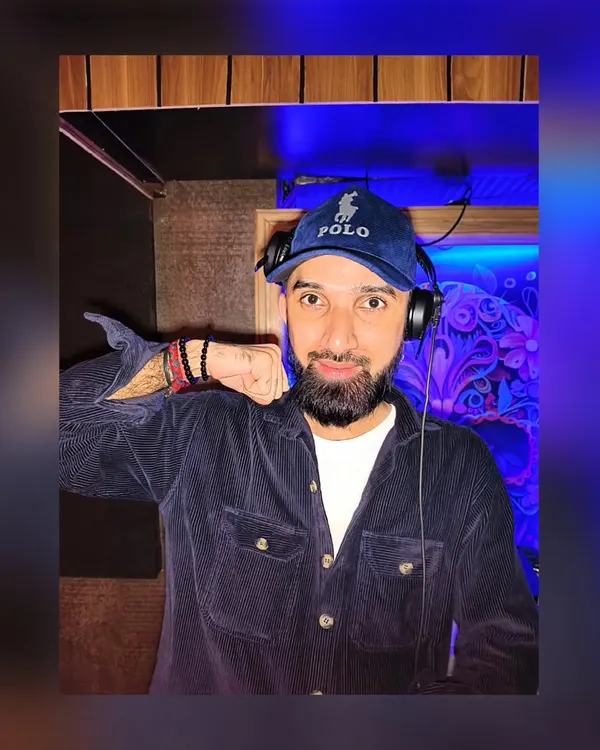 A posed shot in the DJ booth. My personal style and energy are a big part of the brand I bring to every performance.