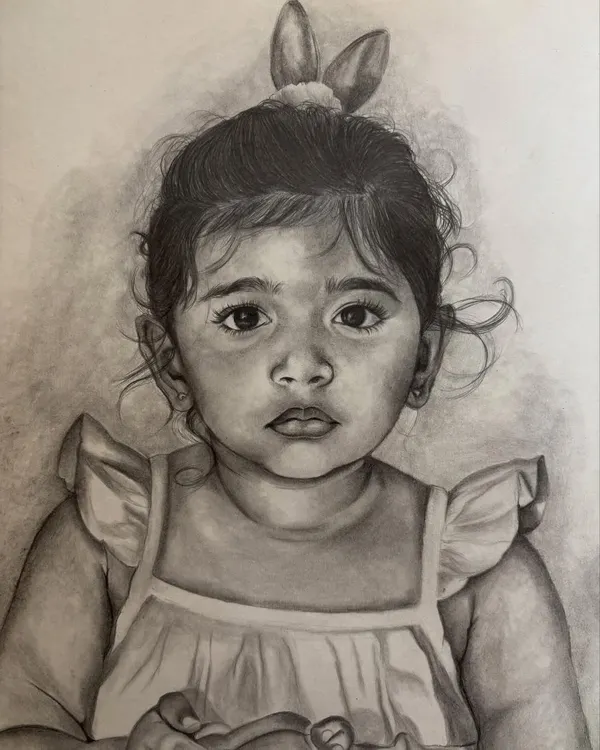 This detailed pencil sketch of a little girl captures her soulful eyes and gentle expression. I love working with graphite to bring out the soft features and innocence of children.