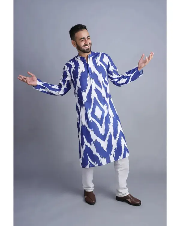 This is a men's kurta shot for an e-commerce catalogue. Working with models on a neutral grey background helps showcase the product's fit, design, and how it moves.