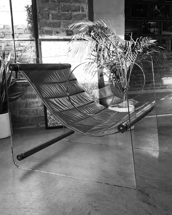 This minimalist lounge chair is one of our signature designs, combining a floating leather seat with transparent acrylic sides. It's a piece that plays with form and material to create something truly unique and visually light.
