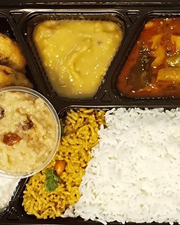 A look at my special festival meal thali. It’s a complete spread with pulihora, white rice, sambar, dal, crispy vadas, fresh curd, and a sweet pongal to finish the meal, just like a festive feast at home.