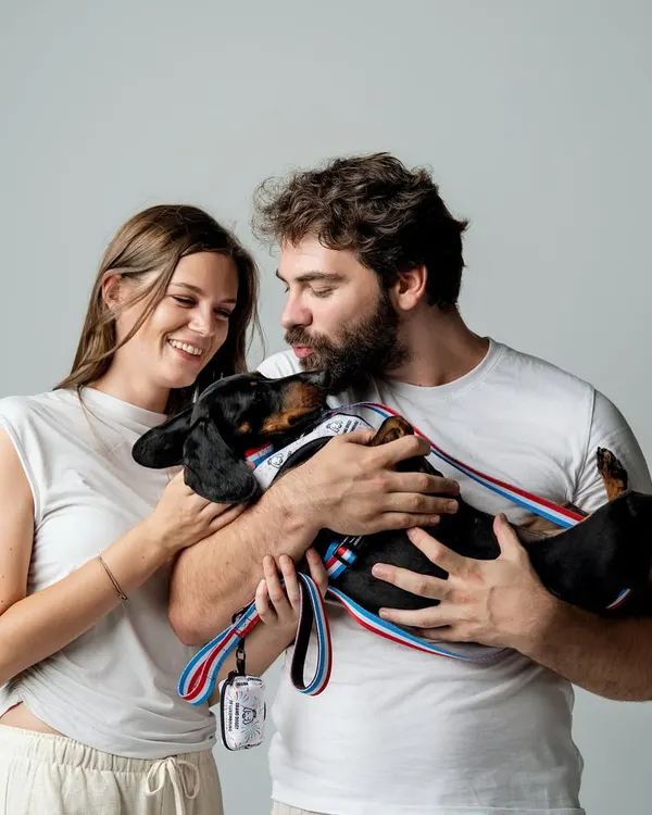 There is nothing more heartwarming than capturing a family's love for their pet. This photo, featuring a couple and their dachshund, is filled with so much affection. It’s a perfect example of pet product lifestyle photography that feels real and unposed.