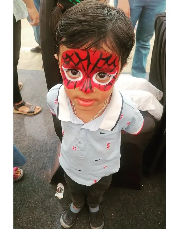 A classic Spiderman full-face transformation, always a huge hit at birthday parties! I use vibrant, safe red and black paint to create the iconic web design, making sure every child feels like a real superhero.