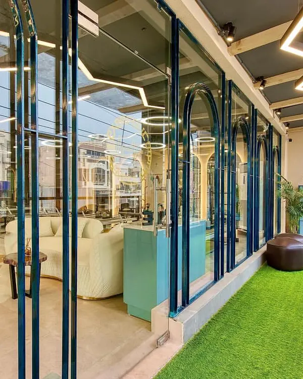 A look at our studio's facade from the inside, showing the seamless fusion of our serene interior with the world outside. The design creates a tranquil, inspiring atmosphere.