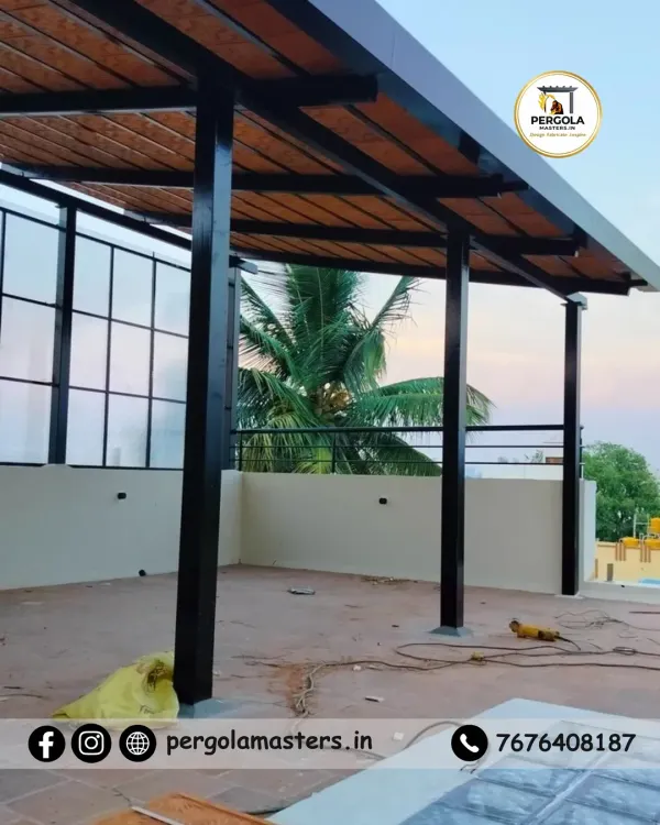 A Mangalore tile pergola under construction on a rooftop. This image shows the strong metal framework supporting the traditional clay tiles, a combination that ensures both authentic style and long-lasting durability.