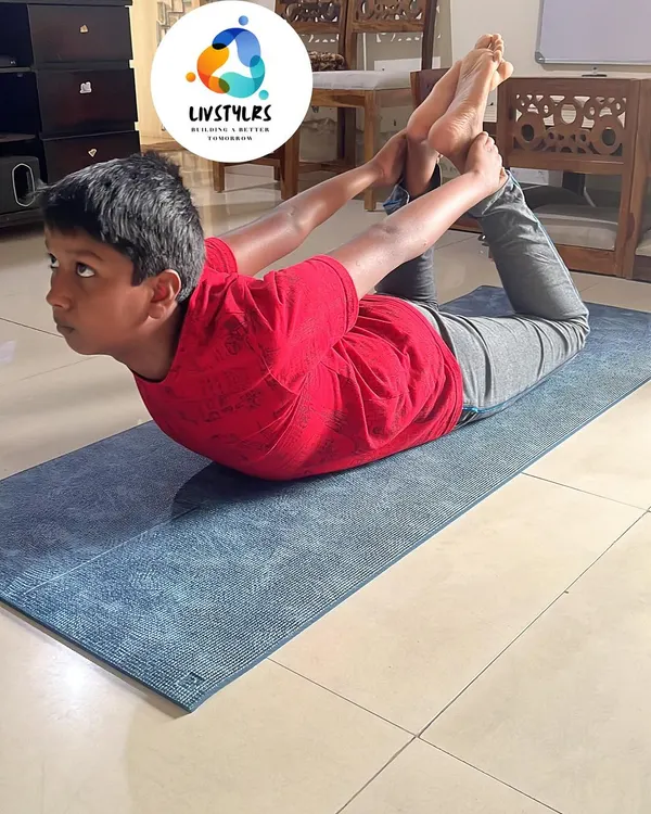 A young client demonstrates incredible strength and flexibility in Dhanurasana (Bow Pose). My kids' yoga classes focus on building a strong and healthy foundation for life.