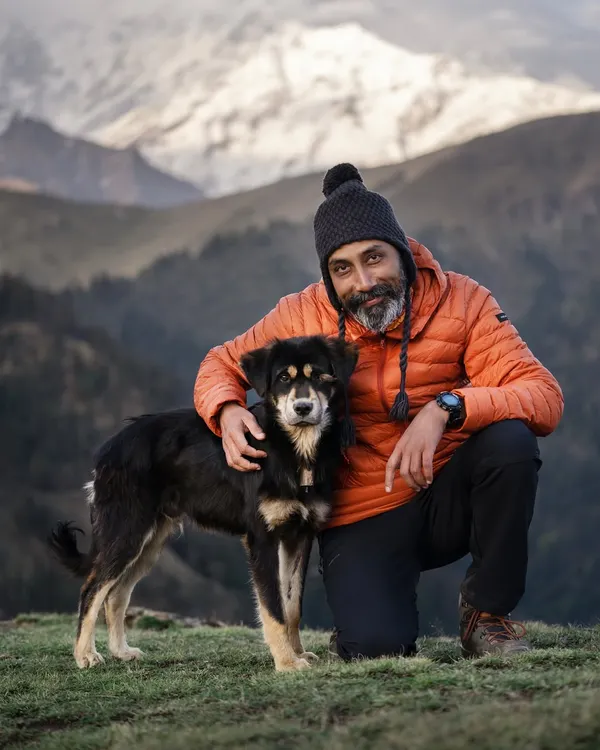 This is me with a friend I made in the mountains. My love for dogs is the foundation of my work. Every interaction, whether on a mountaintop or in a studio, is built on respect and a desire to connect.