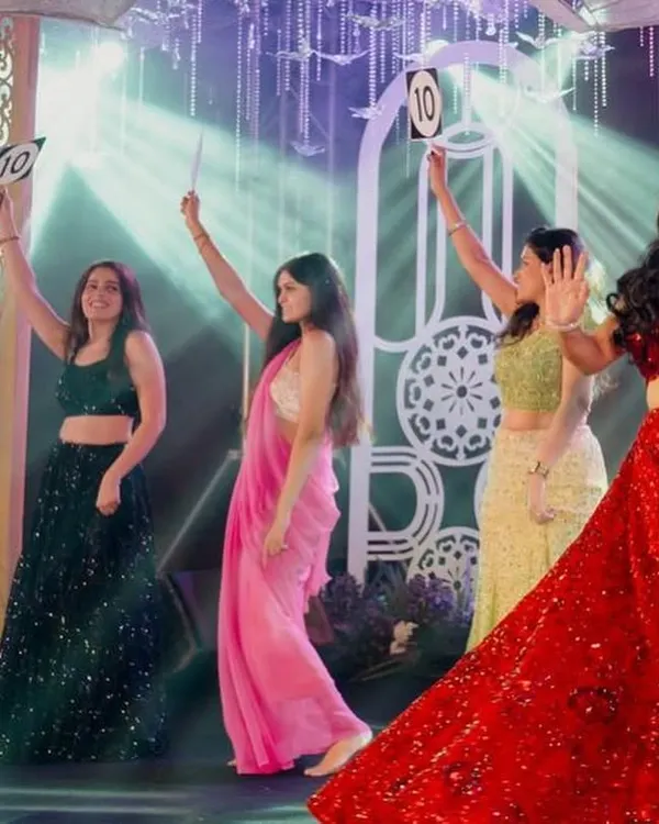 A perfect 10 for the bridesmaids! I love incorporating fun props and concepts into the choreography to make your sangeet performances even more memorable and interactive.