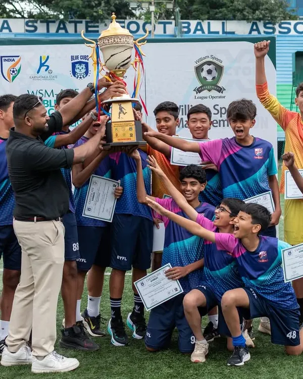 Pure elation! Our U15 team and coaches hoist the championship trophy after a hard-fought season. This victory is a result of their relentless effort and teamwork.