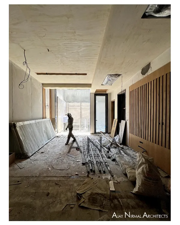 A residence under construction at DLF Phase 1. This image captures the raw volume of the space, with large openings designed to maximize the penetration of natural light and air.
