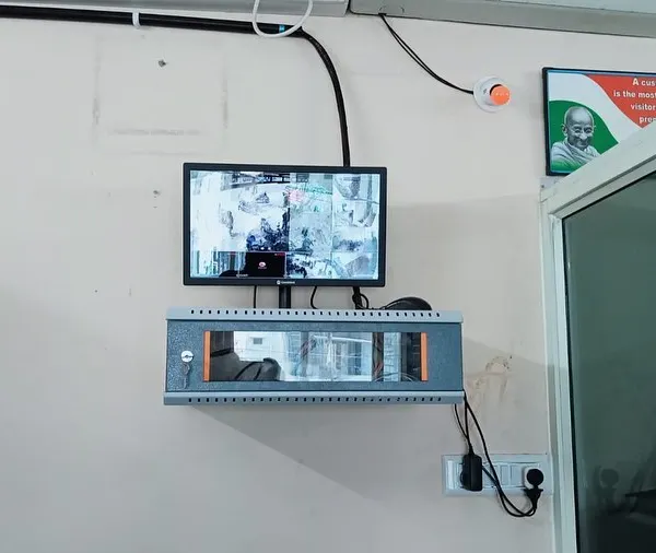 A complete wall-mounted setup with the CCTV monitor and a lockable network rack. This keeps the core of your security system secure and the installation looking clean.