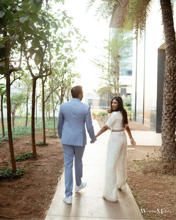 A classic "leading the way" shot from Aayushi and Harshit's Mumbai pre-wedding shoot. Her backward glance and smile create a playful and engaging photo that invites you into their story.