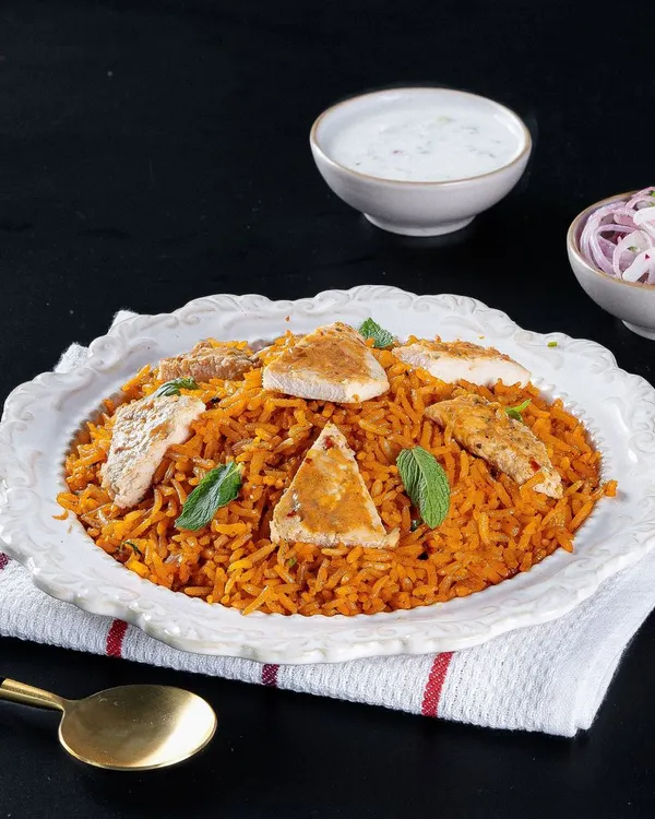 Enjoy our healthy Chicken Biryani, cooked without a drop of oil. It's packed with flavour and served with raita and a fresh salad, so you can enjoy this classic dish guilt-free.