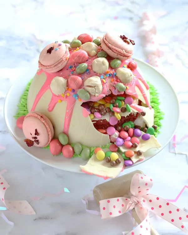 Make birthdays extra exciting with our White Chocolate Dome Pinata Cake. It has a hard chocolate shell that you hammer open to reveal a surprise M&M filling inside!
