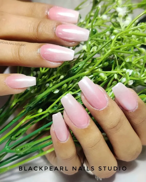 A classic example of the Baby Boomer effect, also known as French Fade. This design features a seamless gradient from a soft pink base to a white tip, creating a timeless and elegant look.