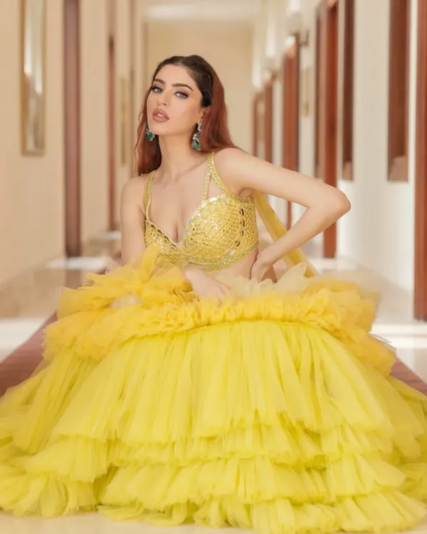 Hello sunshine! This vibrant yellow ruffled lehenga by Liz Paul is the perfect outfit for a Haldi ceremony. It's playful, dramatic, and guaranteed to make you the center of attention.