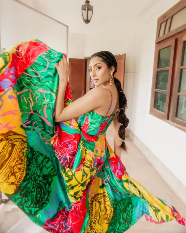 This shot captures the pure joy and energy we love to create. For Advait's Resort '23 collection, we wanted the vibrant, flowing dress to be the star. The movement and the explosion of color in this image represent the artistic and dynamic approach we bring to every editorial fashion shoot.