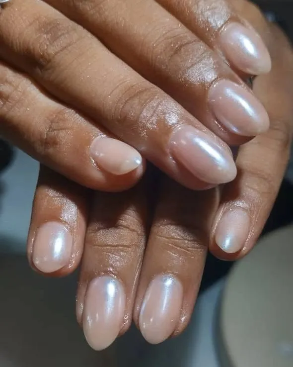 This is the perfect "your nails but better" look. I used a sheer pearlescent gel to create this glazed finish on natural almond-shaped nails. It's clean, healthy-looking, and so elegant.