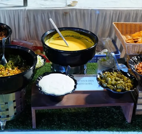 My "Build Your Own Burrito Bowl" station is a popular choice for corporate lunches. It offers a healthy, customizable, and interactive meal with a variety of fresh toppings and sauces.