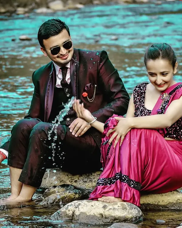A playful pre-wedding moment by the river. I love using natural elements like water to add a fun and dynamic feel to your couple photoshoot.
