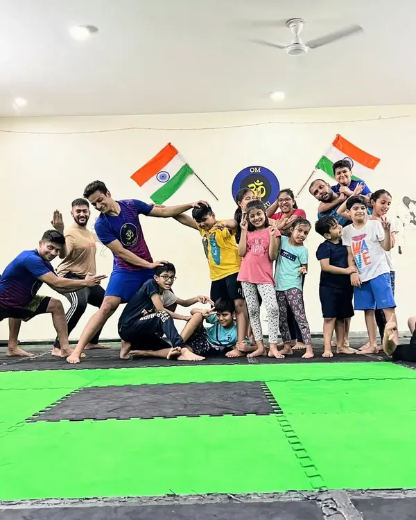 This is what our team is all about. We keep it playful, we keep it real. This photo captures the fun, chaotic, and supportive energy that makes our academy a special place.