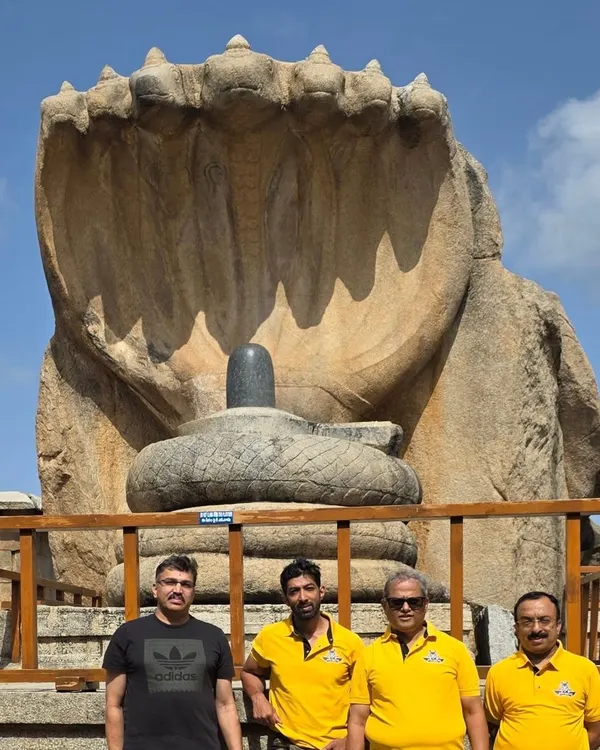 The iconic Naga Linga at Lepakshi serves as a stunning backdrop for our group photo. This monolithic sculpture is a highlight of our heritage ride to Andhra Pradesh.