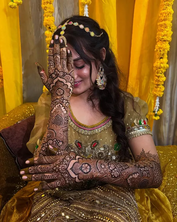 This is what it's all about: a gorgeous bride feeling her absolute best. I loved creating this intricate Pakistani design, ensuring every line was perfect for her special day. The joy on her face is why I do what I do.