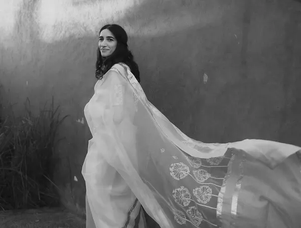 A romantic Haldi lookbook that makes you swoon. This bride is wearing her personality on her sleeve in a timeless white and gold saree.