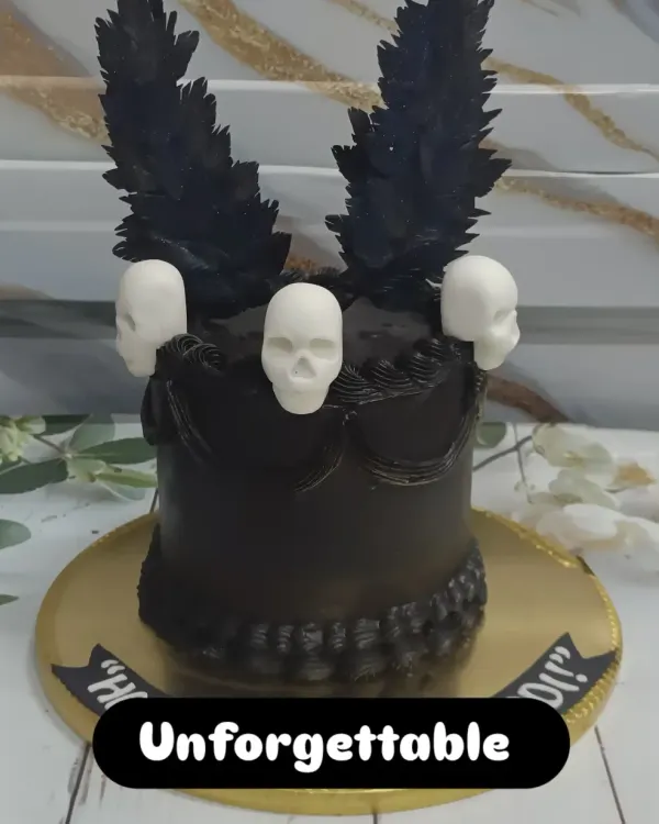 A dark and dramatic chocolate cake. This creation is for the true chocolate lover, featuring black feather-like chocolate shards and white chocolate skulls.