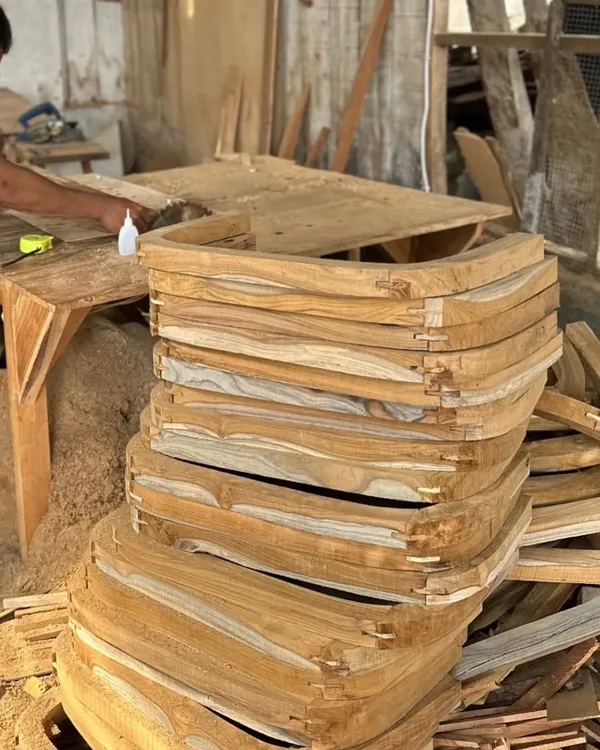 A stack of solid wood components, shaped and joined by hand in my workshop. This is the starting point for many of my custom chair designs.