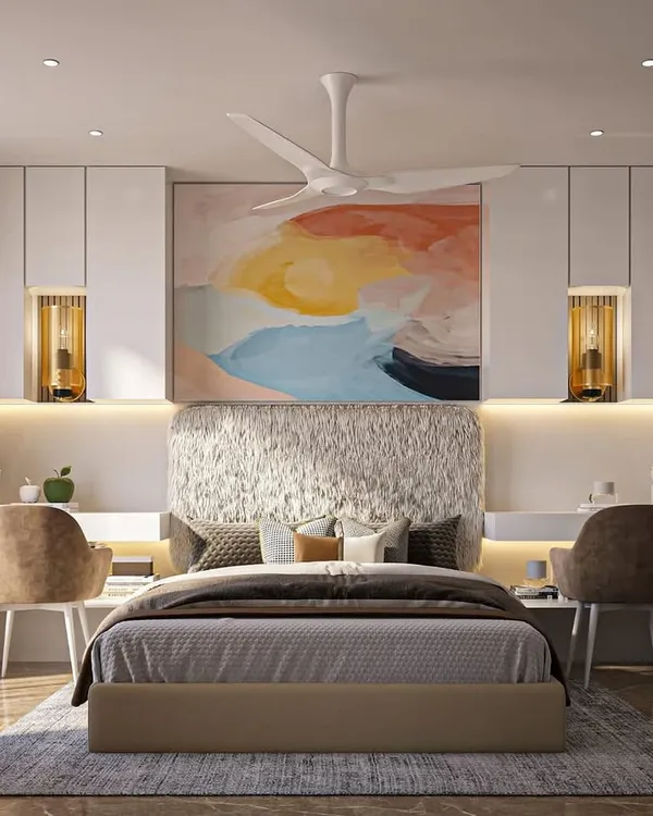 A luxurious and bright bedroom design. The space is centered around a large, colorful abstract painting, with a textured headboard and elegant study nooks on either side, creating a perfect blend of art and function.